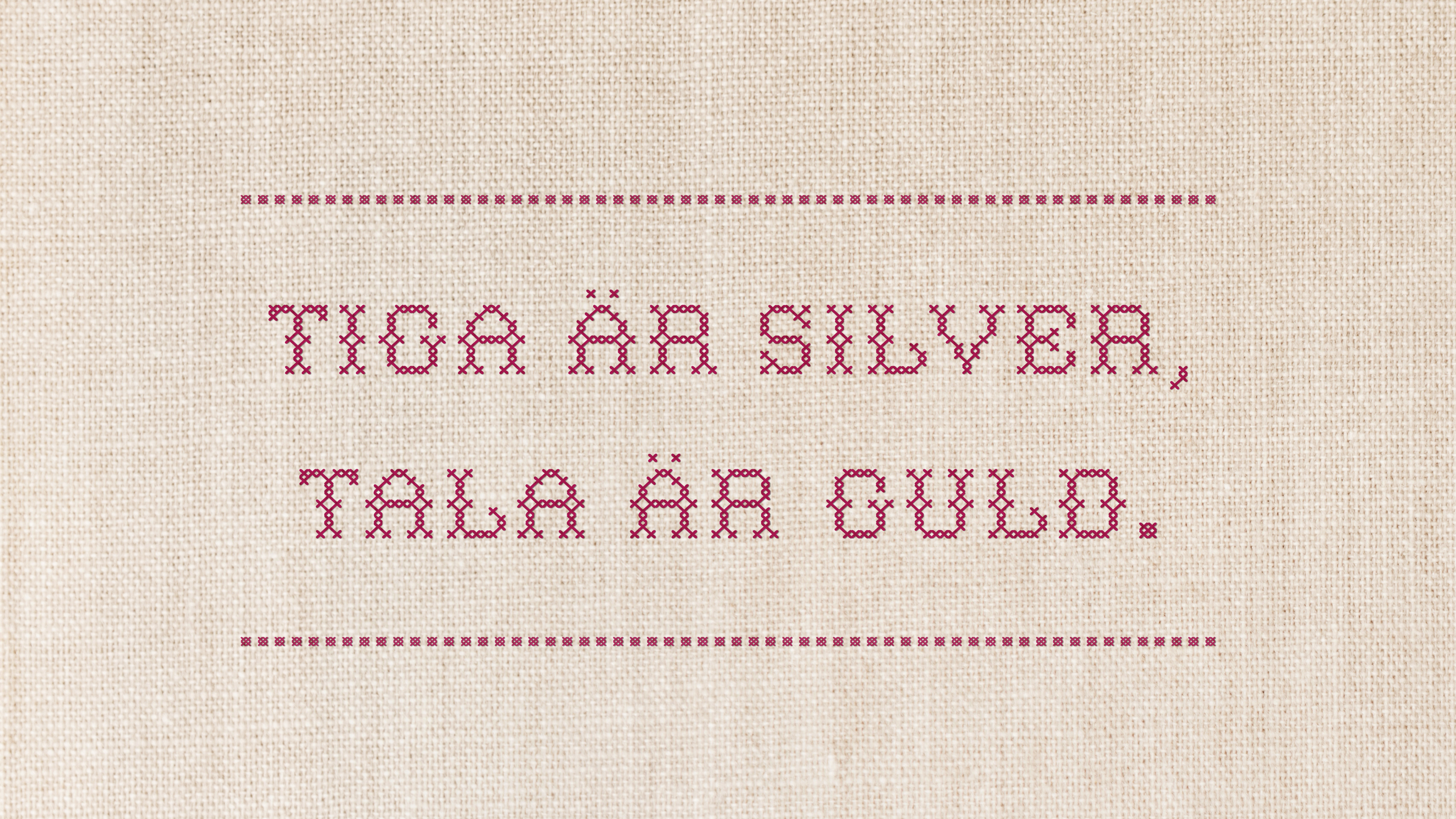 broderad bonad med texten tiga är silver, tala är guld